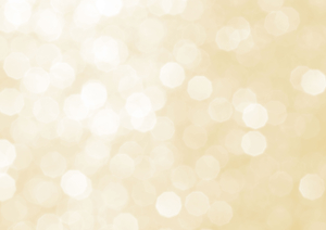 Das Bild zeigt eine unscharfe, helle Hintergrundtextur mit einem sanften, goldenen Bokeh-Effekt.